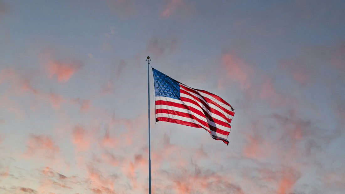 American flag flying above a hockey rink, representing the U.S. prep school hockey environment European players consider on their pathway to North America.